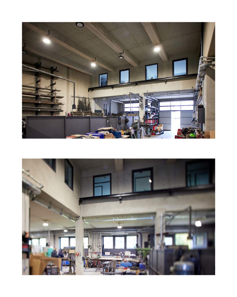 Blick in die weitläufige, helle Produktionshalle im Erdgeschoss mit Sichtbeton-Decke und funktionaler Beleuchtung.